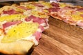 Perspective View of Hot Homemade Traditional Classic Italian Pizza Slice with Meting Cheese, Ham and Pineapple Royalty Free Stock Photo