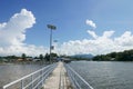 Perspective view of jetty with LED street light with solar cell on clear blue sky. Royalty Free Stock Photo