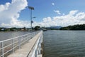 Perspective view of jetty with LED street light with solar cell on clear blue sky. Royalty Free Stock Photo