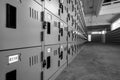 Perspective view of locker with lock and numbered white tags at locker room. Locker for safety and security storage. Row of