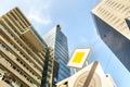 Perspective view of modern high-rise glass skyscraper building and main road traffic sign Royalty Free Stock Photo