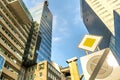 Perspective view of modern high-rise glass skyscraper building and main road traffic sign Royalty Free Stock Photo