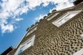 Perspective view of old house, bottom up view. Blue sky, diagonal view