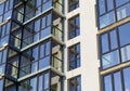 Perspective view of part facade of new building with glazed balconies Royalty Free Stock Photo