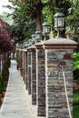 Perspective view of retro lanterns on pillars stacked of bricks