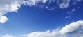 Perspective view of romantic navy blue sky with white grey clouds. High resolution artistic skyline background image Royalty Free Stock Photo