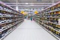 Perspective view of a shelves with alcoholic beverages in supermarket Royalty Free Stock Photo