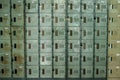 A perspective view of a stack of grey metal school lockers with combination locks Royalty Free Stock Photo