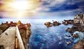 Perspective view of a stone pier in the sea. Seascape background in the ocean. Travel and vacation concept. Tenerife,