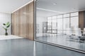 Perspective view on stylish meeting room with bookshelf, white furniture and city view background from big window in sunlit office