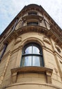 perspective view of a 19th century tall stone neoclassical building with ornate curved windows in the little germany business Royalty Free Stock Photo