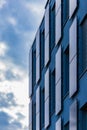 Perspective view to facade of modern corporate building with reflections in windows Royalty Free Stock Photo