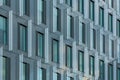 Perspective view to facade of modern corporate building with reflections in windows Royalty Free Stock Photo