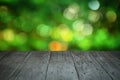 Perspective wood and blurred nature with bokeh light background. Royalty Free Stock Photo