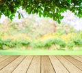 Perspective wood over blur trees with bokeh background Royalty Free Stock Photo