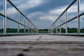 Wooden bridge perspective storm cloud