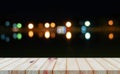 Perspective wooden board over bokeh light at night