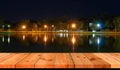 Perspective wooden board over lake at night