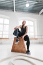 Perspiring male athlete resting after intense cross workout