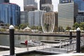 Perth, WA, November 2019: Elizabeth Quay with Perth city center, modern skyscrapers and famous sculpture called Spanda.