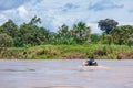 Peru, Amazon river - 2019-12-08. People in a wooden boat, beautiful clouds . Royalty Free Stock Photo