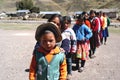 Ayacucho children in a poor school entering the classrooms with their teacher