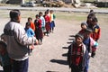 Ayacucho children in a poor school entering the classrooms with their teacher