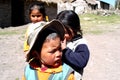 Peru Ayacucho, poor children in school studying in the mountains with row and teacher typical clothing in the Andes