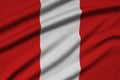 Peru flag is depicted on a sports cloth fabric with many folds. Sport team banner Royalty Free Stock Photo