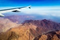 Peru - Airplane Window Wing View of Andes Mountains from Fight over Mountain Range