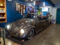 Volkswagen beetle Reception desk with headlights turn on at hotel reception, blue wall with