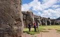 Peru, May, Saksaywaman, Inca fortress near Cusco, guide with young backpacker couple
