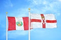 Peru and Northern Ireland two flags on flagpoles and blue sky