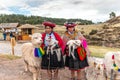 Peru - October 11, 2018: Peruvian women in dress with lamas