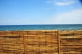 Peru bamboo fence without people with blue sky and sea peaceful rural scene