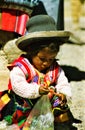 ISLA TAQUILE TITICACA LAKE, PERU - JUIN 10. 2002: Portrait of cute indigenous child with hat and traditional clothes