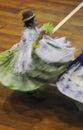 Peru woman dancing with her typical colorful clothes during a musical show at La Vigen de la Candelaria carnival