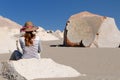 Peru, Tourist on the desert watching Toro Muerto Petroglyphs