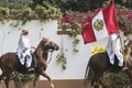 Peru traditional paso horses with chalan with their typical clothes on a hacienda with their Peruvian flag