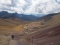 Local walks up the path to the seven colors mountain carrying bag