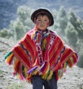 Peruvian boy dressed in colourful traditional handmade outfit Royalty Free Stock Photo