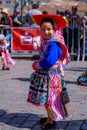 Peruvian child in a colorful traditional costume during an ancient religious ceremony of Inti Raymi