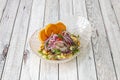 Peruvian corvina ceviche with red onion, parsley, sweet potato slices in a beautiful glass bowl Royalty Free Stock Photo