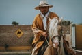 Peruvian cowboy riding a horse