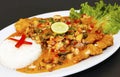 Peruvian culinary fried fish A lo Macho style with seafood sauce