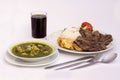 Peruvian Dish: Chicken soup of coriander(aguadito de pollo)+chicha morada, beef grilled with rice.