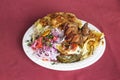 Peruvian Dish: Doble from Arequipa. Fried pig (Chicharron), smashed potatoes (pastel de papa), onion, tomatoes, spaghetti with c