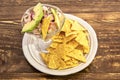 Peruvian fish ceviche with a slice of avocado mounted in a glass and garnished with nachos Royalty Free Stock Photo