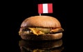 Peruvian flag on top of hamburger on black