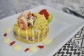 Peruvian Food: Causa rellena de atun. Tuna causa rellena. Traditional peruvian dish from yellow potato, tuna, avocado on white Royalty Free Stock Photo